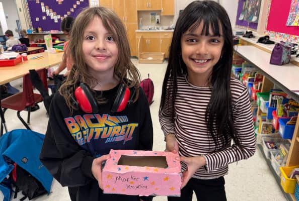 Linsford Park PIF Project 2025 Linsford Park PIF Project 2025: 2 girls hold a marker collection box they decorated.