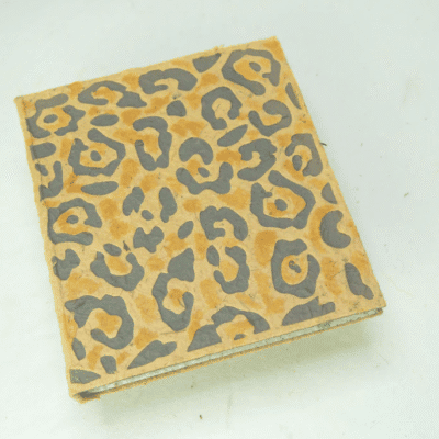 Image of a journal made out of poo with jaguar print on the front