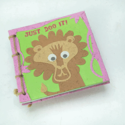 Image of a poo paper journal with a lion on it saying just doo it